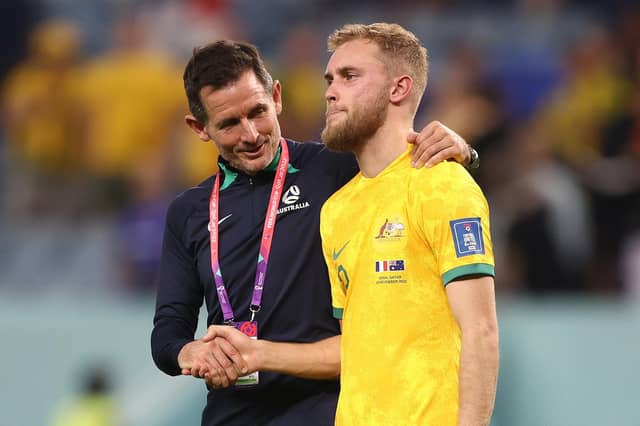 Nathaniel Atkinson is controlled by an Australian coach after his team's 4-1 loss to France at Al Janoub Stadium. Picture: Robert Cianflone/Getty