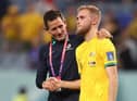 Nathaniel Atkinson is controlled by an Australian coach after his team's 4-1 loss to France at Al Janoub Stadium. Picture: Robert Cianflone/Getty