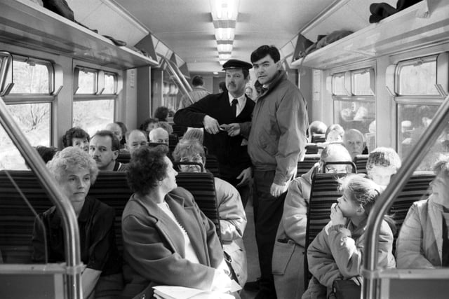 The Abbeyhill Action Group take a train ride in March 1989 after proposing that the Abbeyhill loop should be re-opened in March 1989. Group organiser Harold Nicholson is pictured checking Councillor David Begg's ticket.