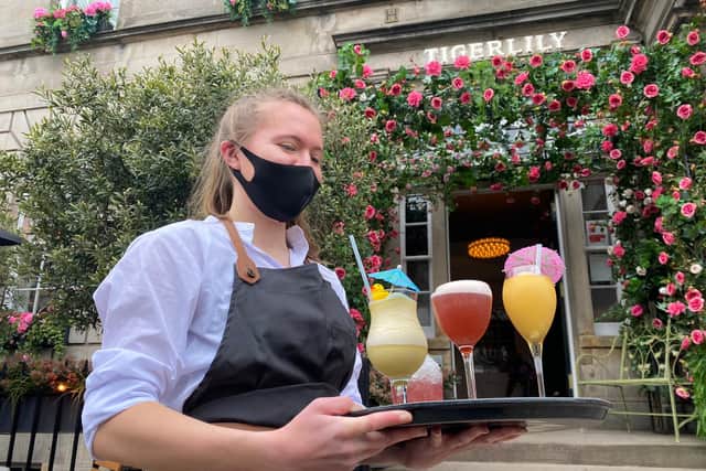 Bars across Edinburgh reopen for the first time in months as coronavirus restrictions on hospitality ease.