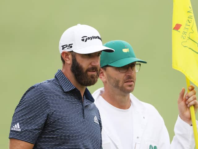 Dustin Johnson stands with his brother/caddie Austin on the tenth green during the final round of the Masters at Augusta National. Picture: Jamie Squire/Getty Images
