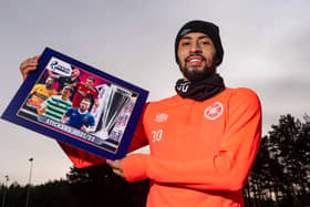Josh Ginnelly helps to promote the SPFL 2021/22 sticker collection as the Hearts star looks forward to Saturday's game against St Mirren. Picture: SNS