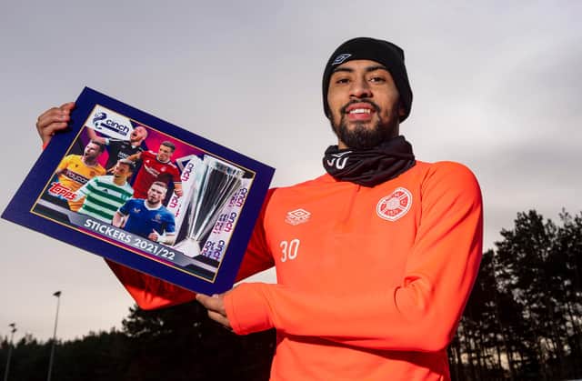 Josh Ginnelly helps to promote the SPFL 2021/22 sticker collection as the Hearts star looks forward to Saturday's game against St Mirren. Picture: SNS