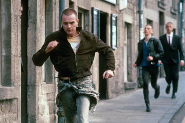 Renton and Spud are chased by security guards in a scene from Trainspotting (Picture: Liam Longman/Figment/Noel Gay/Kobal/Shutterstock)
