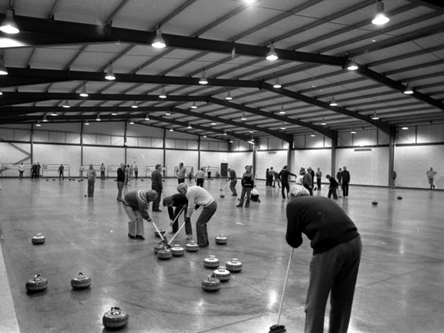 Curlers check out the new seven lane curling rink at Murrayfield in Edinburgh. Year: 1980