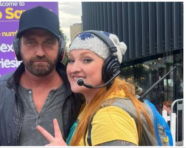 Gerard Butler was pictured with a member of the Silent Adventures team, who run the silent disco at Bristo Square in Edinburgh. Photo: Silent Adventures