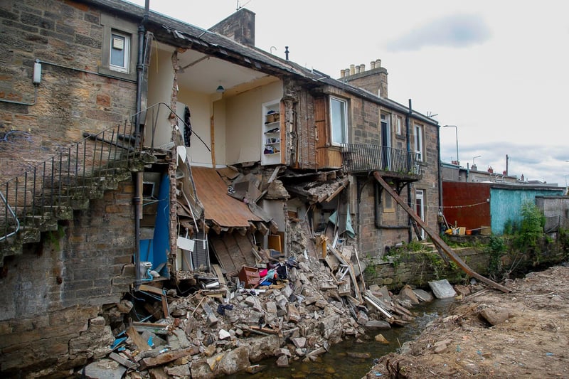 Evacuated houses at Longstone Road slipped into the Murray Burn off the Water of Leith in July 2019.