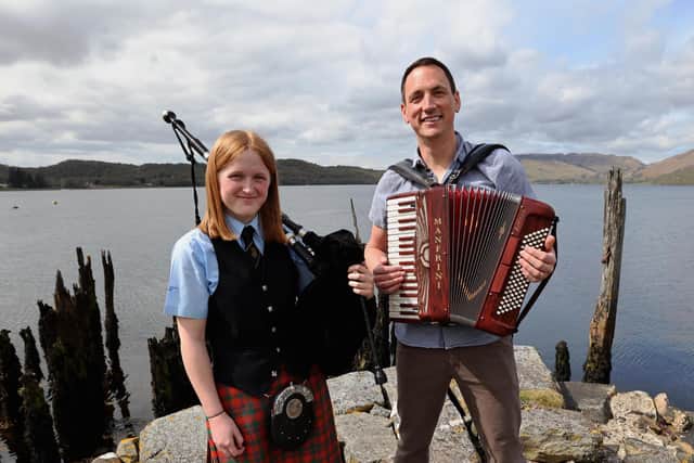 Gary Innes, BBC Scotland presenter and founding member of Scottish supergroup Mànran, launches Scottish Folk Day with piper Katie McEwan of Oban High School Pipe Band, who are just back from New York’s Tartan Week. Picture: Kevin McGlynn