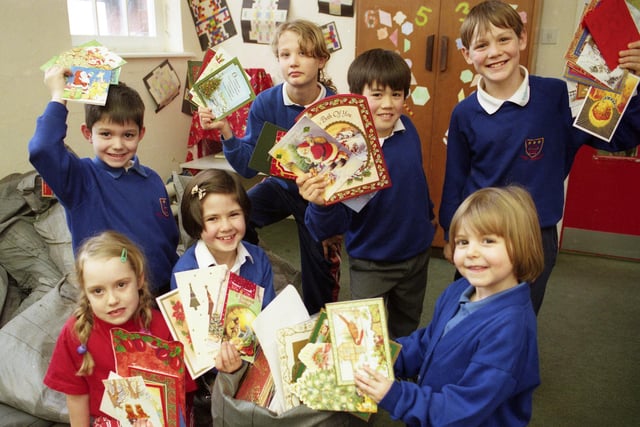 Pupils from John F Kennedy Primary School filled 20 sacks with used cards from Christmas in this January 1999 photo. Who do you recognise?