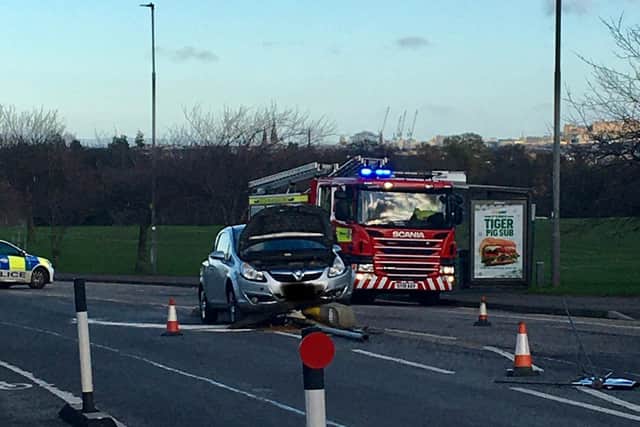 A motorist collided with the traffic island after apparently swerving to avoid a car in a floating parking space.