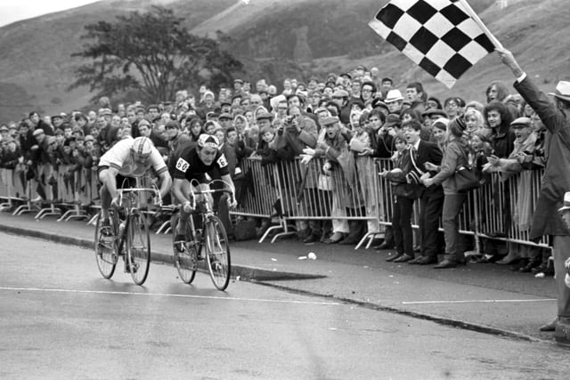 New Zealander Bruce Biddle and Australian Ray Bilney race towards the chequered flag at the finish of the 102 miles cycling road race during the Commonwealth Games.