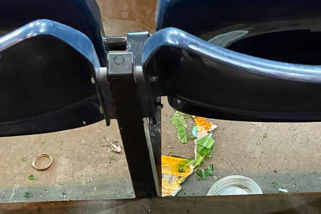 A broken glass bottle of Buckfast which Hibs fans allege was thrown from the section above them housing Rangers supporters