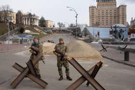 Ukrainian soldiers guard a checkpoint at Independence Square in Ukraine's capital Kyiv (Picture: Anastasia Vlasova/Getty Images)