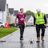Linlithgow Rose captain Gary Thom and Cala’s Preston Glade site manager David Stewart have a kickabout (pic: Cala Homes (East))