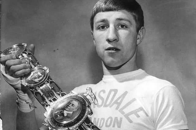 Ken Buchanan holding a Lonsdale Belt as a British Boxing Champion in 1968.