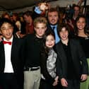 Jack Black (back) with the child cast members (L-R) Robert Tsei, Kevin Clark, Miranda Cosgrove, Joey Gaydos, and Rivkah Reyes attend the gala screening for 'School of Rock' during the 2003 Toronto International Film Festival (Photo: Donald Weber/Getty Images)