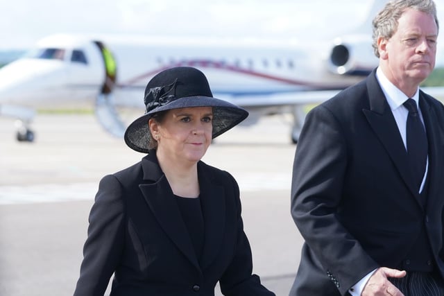 Scottish Secretary Alister Jack and First Minister of Scotland Nicola Sturgeon leave Edinburgh Airport after the arrival of King Charles III and the Queen Consort, who will join other members of the royal family for the procession of Queen Elizabeth's coffin from the Palace of Holyroodhouse to St Giles' Cathedral, Edinburgh. Picture date: Monday September 12, 2022.