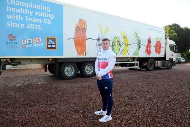 Team GB's cycle team sprinter Jack Carlin (correct), pictured with the lorry designed by Isabella. 
Photography from: Colin Hattersley