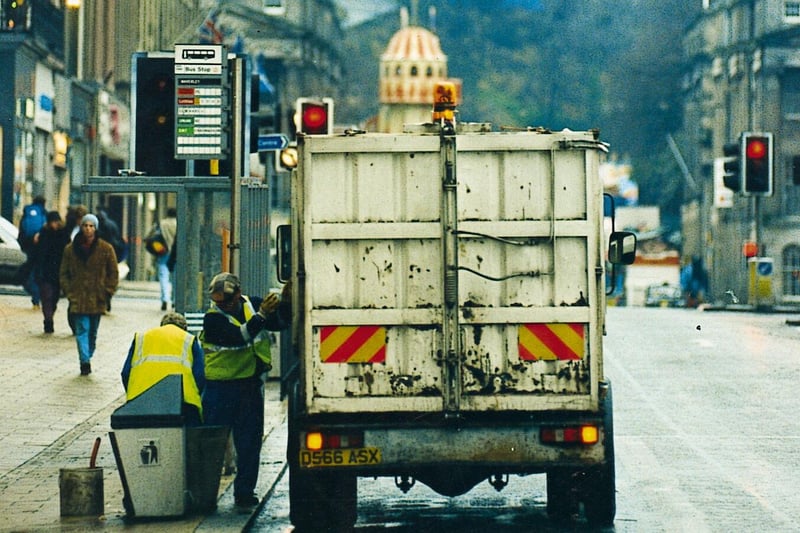 Cleansing department road cleaners clearing up Princes Street after the 1995 Hogmanay celebrations.