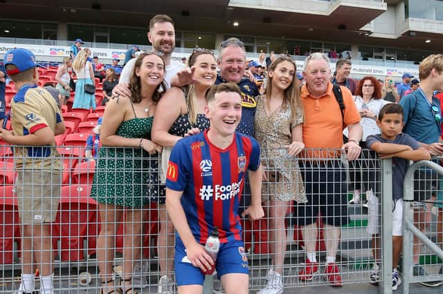 Hearts defender Bobby Burns with family at a recent Newcastle Jets match.