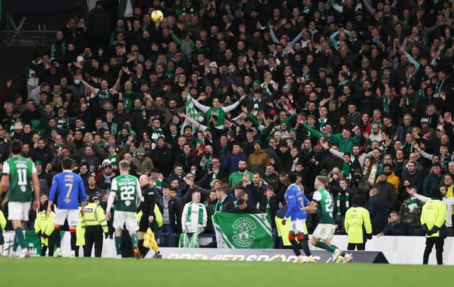 Hibs fans celebrate during the Premier Sports Cup victory over Rangers. Picture: SNS