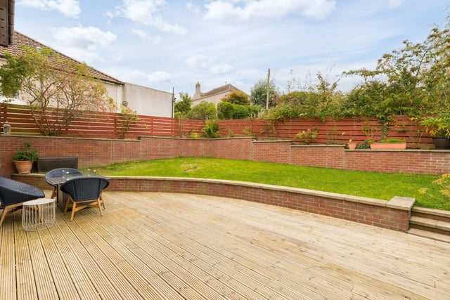The property benefits from well-maintained front, side and rear gardens, with the rear garden laid to lawn with decking area. There is also a single integral car garage and a driveway with a electric vehicle charging point.