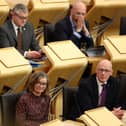 Kate Forbes MSP (L) and John Swinney MSP (R) attend the motion of no confidence vote in the Scottish Government on May 1