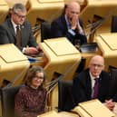 Kate Forbes MSP (L) and John Swinney MSP (R) attend the motion of no confidence vote in the Scottish Government on May 1