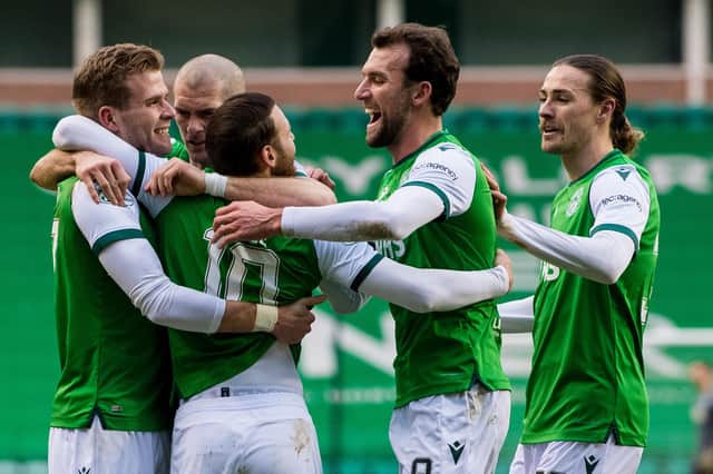 Hibs players swarm matchwinner Martin Boyle as they moved five points ahead of their main rivals, Aberdeen, in the chase for third place. Photo by Ross Parker / SNS Group
