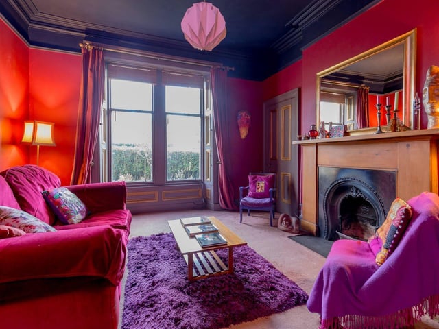 There is a versatile twin-windowed family room which has a feature fireplace.