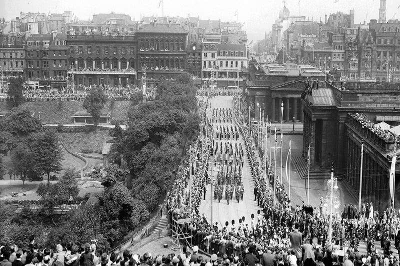 The Royal Procession travels up the Mound, Edinburgh, during Queen Elizabeth II's Coronation visit in June 1953.