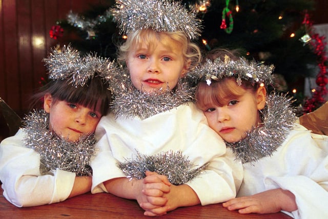 Primary one pupils Amy McLay, Hope McNicoll and Deaven Howarth are angels in their school nativity play. Picture: 15 December 2000
