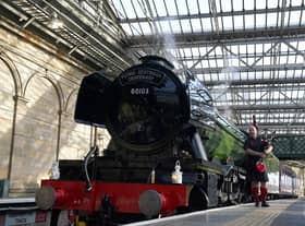 Piper Kevin MacDonald from the Red Hot Chilli Pipers, during an event at Edinburgh Waverley station to mark the day the world famous locomotive, Flying Scotsman, entered service on February 24 1923.