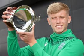Hibs defender Josh Doig with the Doubletree by Hilton Scottish Football Writers' Young Scottish Player of the Year award. Photo by Steve Welsh