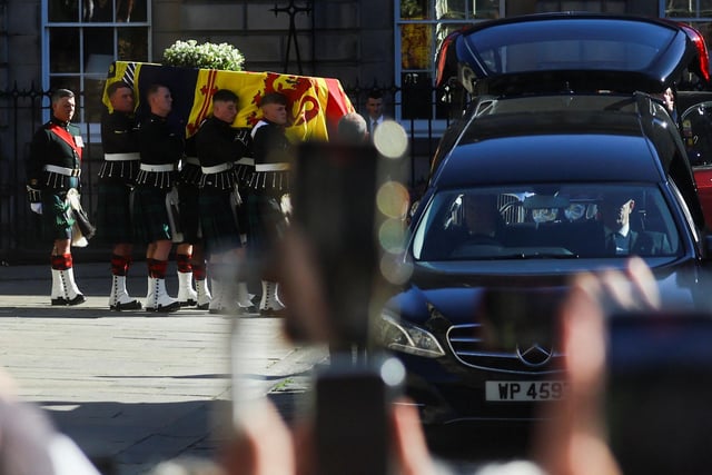 Pallbearers carry the coffin of Queen Elizabeth II from St Giles' Cathedral, Edinburgh, after a prayer service.