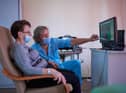 A therapist explains test results to a long Covid patient (Picture: Bartosz Siedlik/AFP via Getty Images)