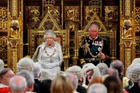 Queen Elizabeth II  in the House of Lords next to Britain's Prince Charles, Prince of Wales before reading the Queen's Speech (Photo by TOLGA AKMEN/POOL/AFP via Getty Images)