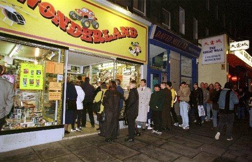 Shoppers queue up outside Wonderland on Lothian Road, hoping to get their hands on a Furby - a popular American robotic toy - that had just gone on sale. December 1998.