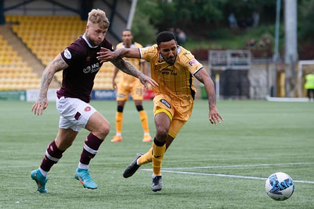 Hearts debutant striker Stephen Humphrys, who was at fault for the winning goal, takes on Livingston match winner Cristian Montano. Picture: Paul Devlin / SNS