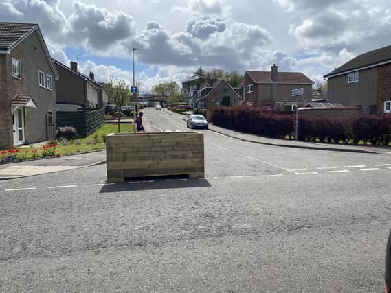 Some parts of the Spaces for People scheme, such as this planter on Barberton Mains Wynd, have proved to be controversial (Picture: SWNS.com)