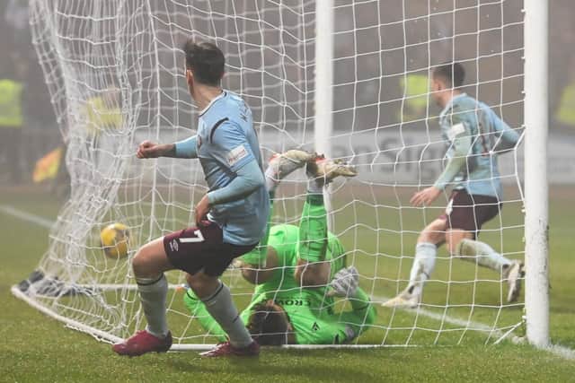 On a rare appearance from the bench for Hearts, Jamie Walker fires into the roof of the net from a tight angle after the ball rebounded off the post from a deflected Aaron McEneff strike. It proved to be the winner