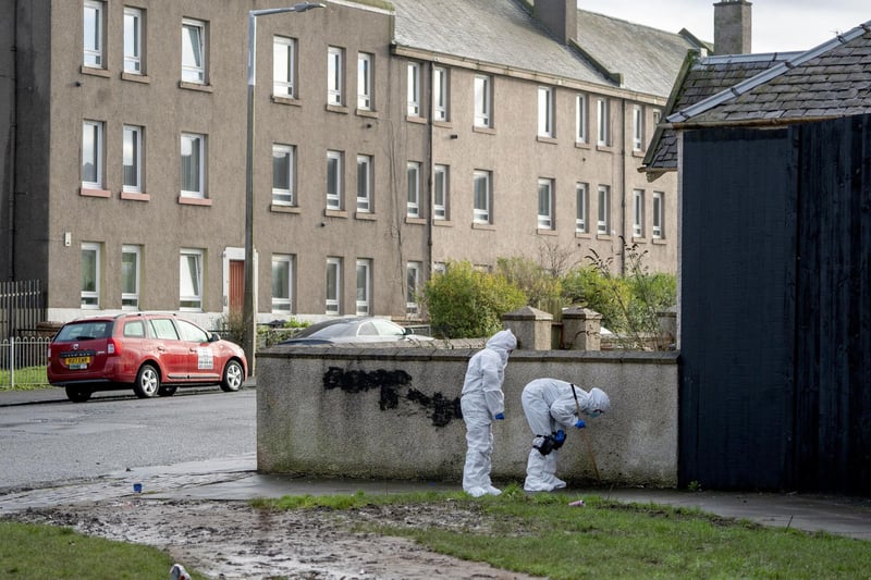 Forensic officers scour the area close to the scene near the Anchor Inn in Granton
Photo: Jane Barlow/PA Wire