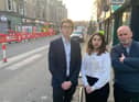 Tory councillor Scott Douglas (left) with local traders Eva Papadaki and George Rendall.