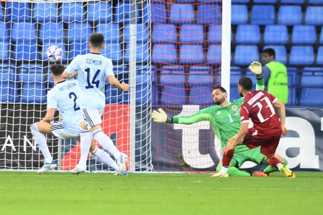 Armenia's Vahan Bichakhchyan, right, dispatches beyond Scotland goalkeeper Craig Gordon to give the hosts the lead. Picture: AP