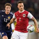 Scotland defender Jack Hendry, pictured with Austria striker Marko Arnautovic, scored in Vienna on Tuesday but had several uncomfortable moments at the back. (Photo by Christian Hofer/Getty Images)