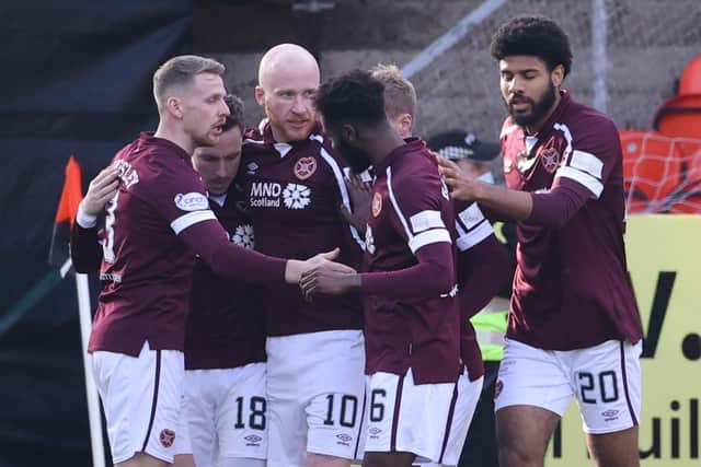 Hearts players celebrate Liam Boyce's early goal at Tannadice on Saturday.