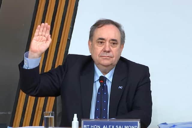 Alex Salmond takes the oath before giving evidence in Holyrood.