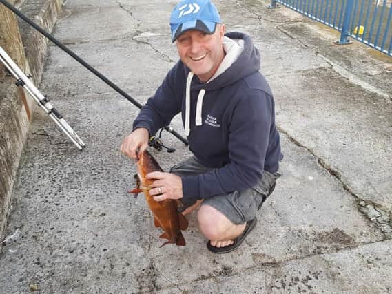 Barry McEwan fishing at Dunbar Harbour wall in a match run by the Bass Rock Shore Angling League