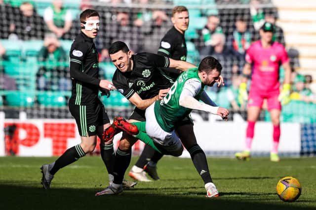 Celtic midfielder Tom Rogic halts Wright during the goalless draw at Easter Road
