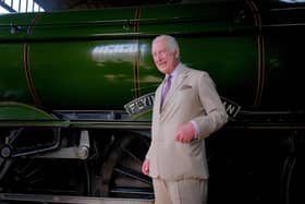 King Charles in front of The Flying Scotsman at Pickering Station